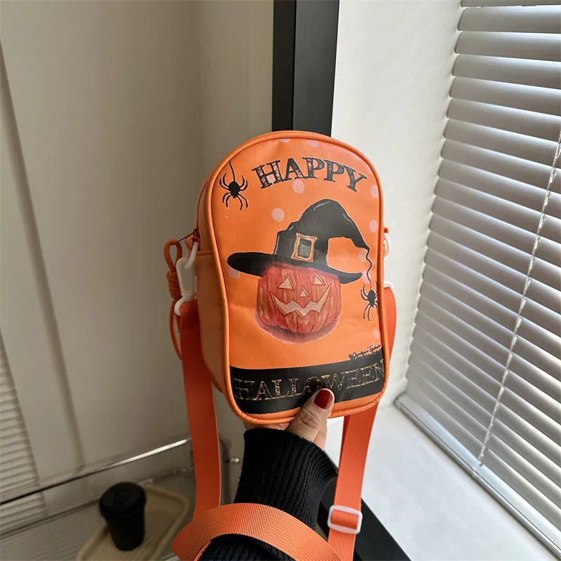 Women's black mini crossbody bag with orange Halloween pumpkin graffiti print.