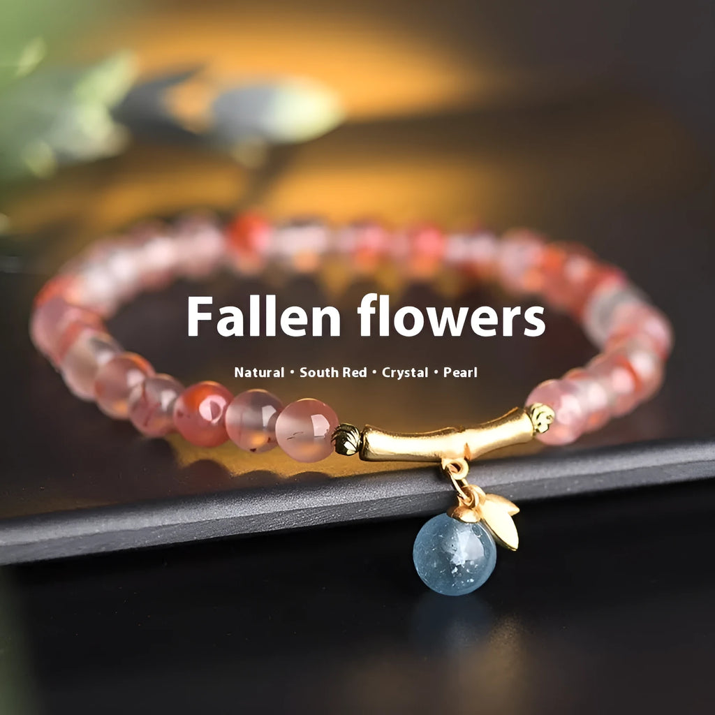 Ice float nanhong agate bracelet with floral shape and bamboo joint design on a wrist.