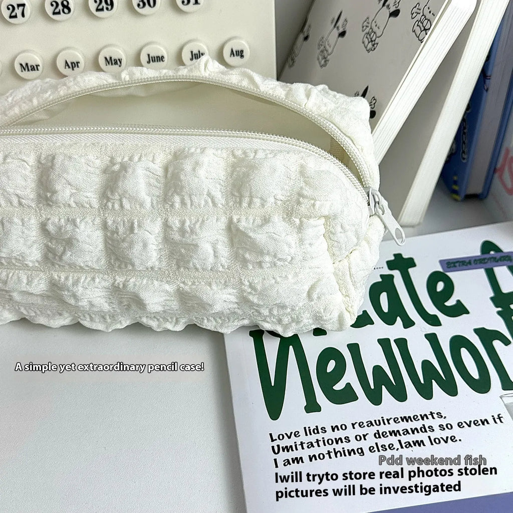 Cream puff texture polyester pencil case in beige and black colour options