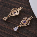 Water drop pendant with crown design in five colour options measuring 12mm by 23mm