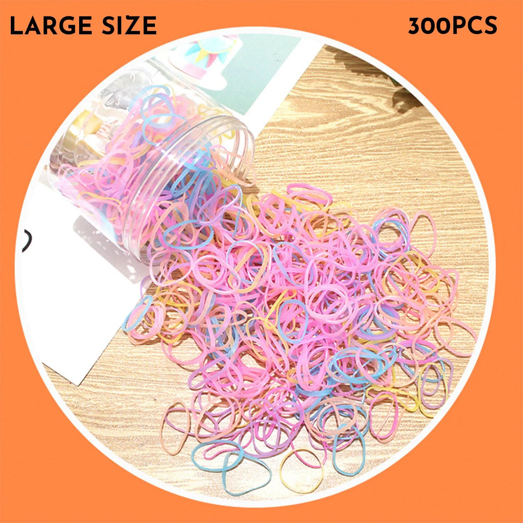 Pack of multicoloured thin TPU baby hair ties for toddlers in a reusable clear storage container.
