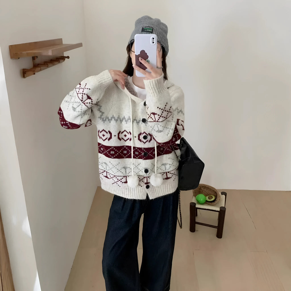 Loose grey brocade sweater coat with geometric pattern on a plus-size model.