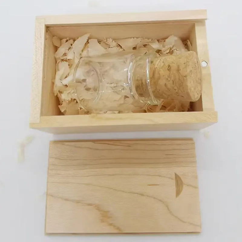 Transparent wooden wish drift bottle containing a USB flash drive on a white background.