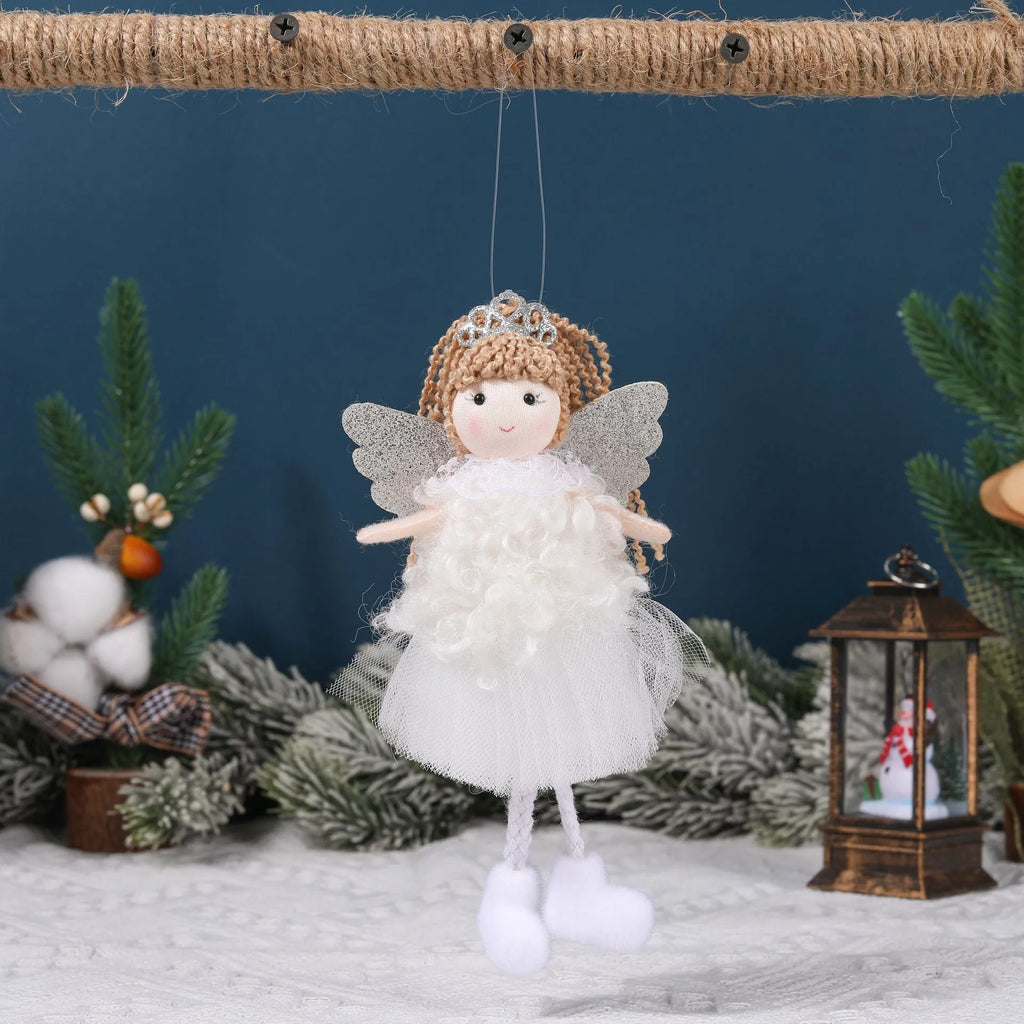 Cartoon angel cloth hair clip for a girl's Christmas ponytail in khaki, pink, or white.