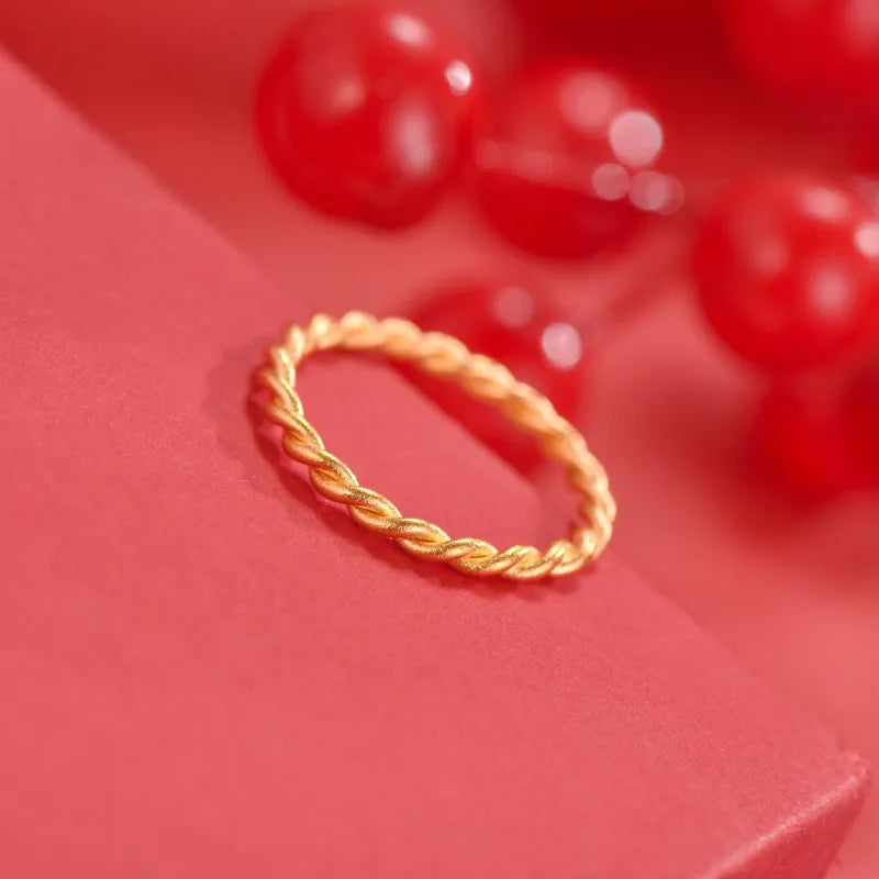 Women's simple bracelet style brass gold plated ring shown in twist, matte and glossy finish variations.