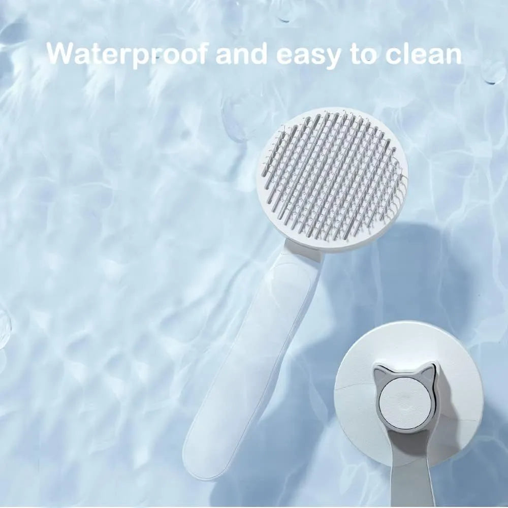 Self-cleaning pet brush with rubber handle and massage needles for cats and dogs
