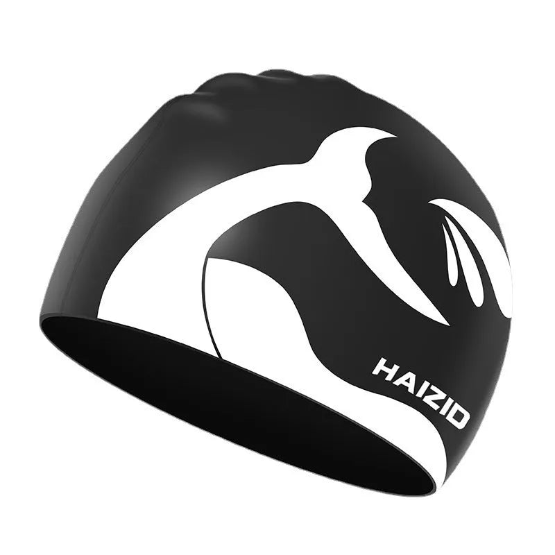 Silicone swim cap with whale tail pattern and integrated ear protectors in multiple colour options