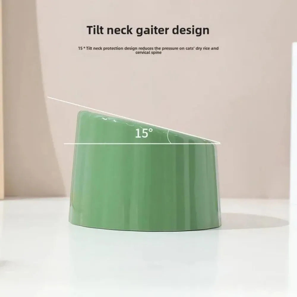 Dark green cat bowl with cactus design and anti-slip base on a wooden surface.
