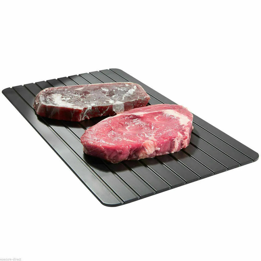 Black aluminium fast defrosting tray for thawing frozen meat and food.