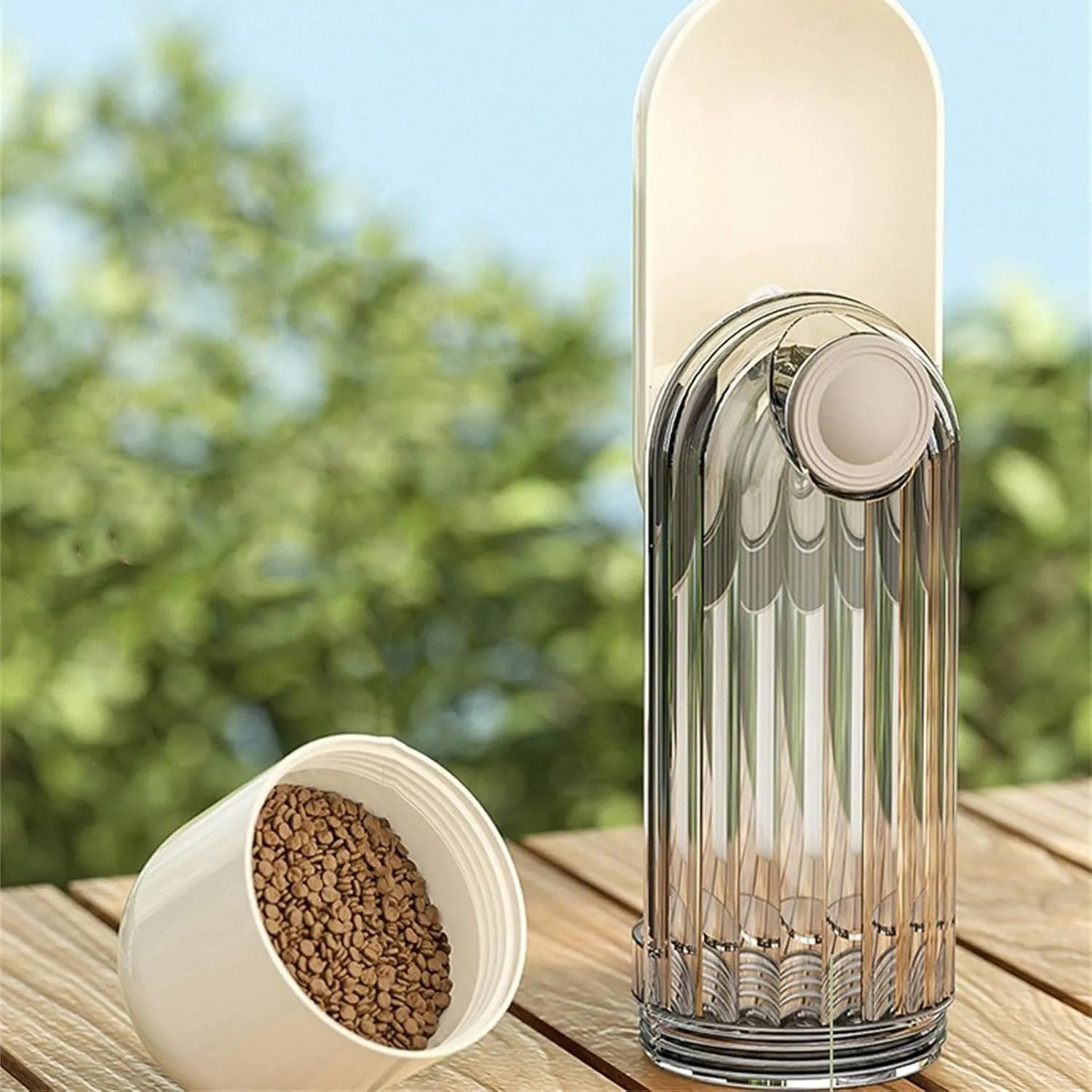 Foldable dog water bottle with food dispenser in beige or green colour for walking and hiking