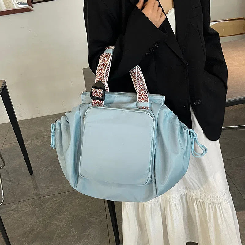 Nylon mommy bag in large capacity tote style, available in multiple colours for travel and daily use