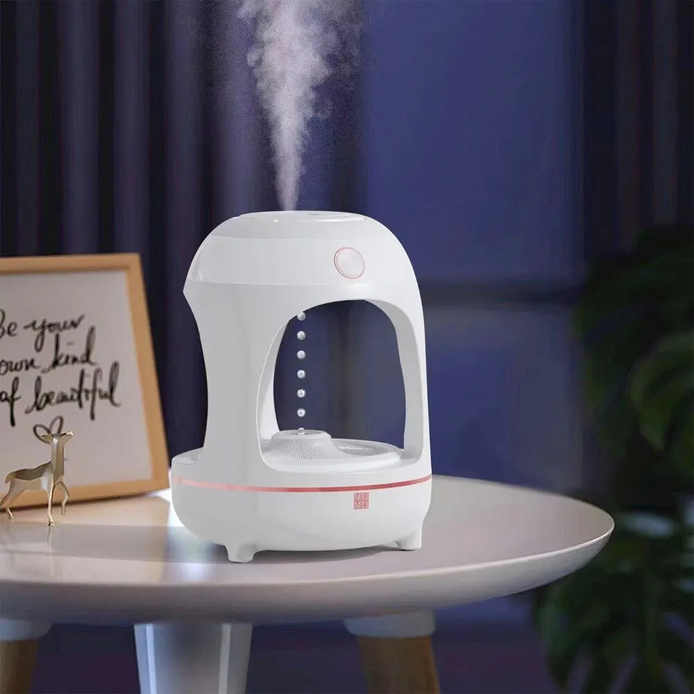 Rose gold and white ultrasonic humidifier with levitating water drop design and LED night light