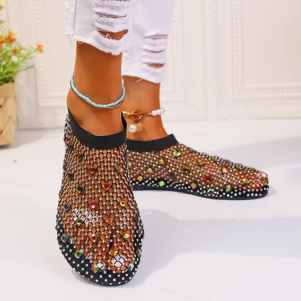 Women's colourful rhinestone and white mesh flat sandals on a rubber sole.