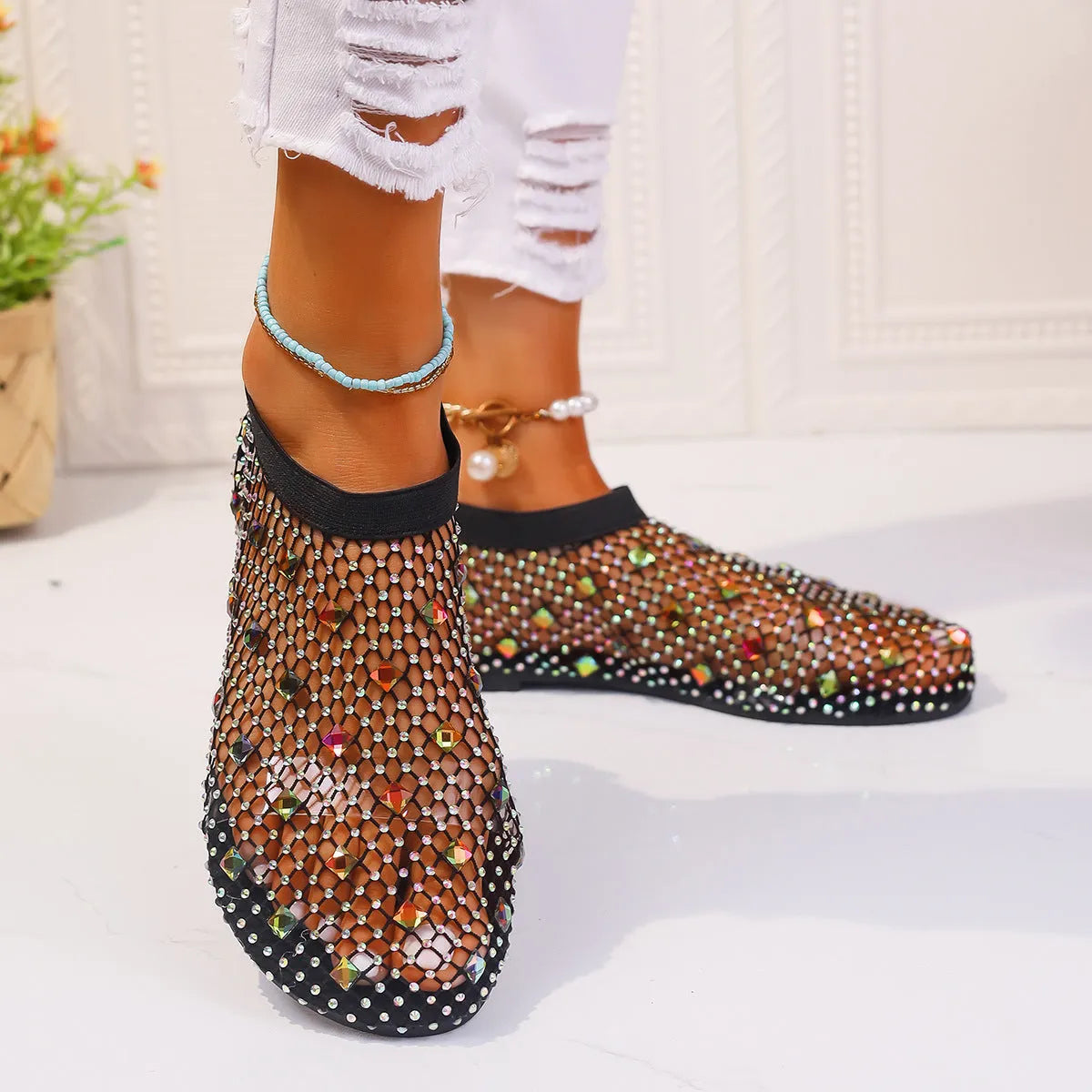 Women's colourful rhinestone and white mesh flat sandals on a rubber sole.