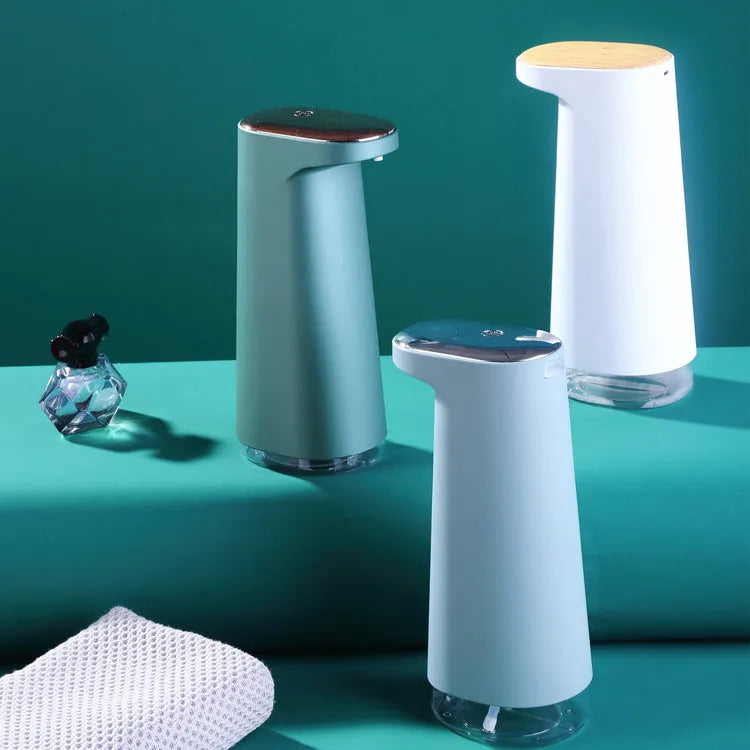Automatic foam soap dispenser with infrared sensor in white colour on bathroom counter