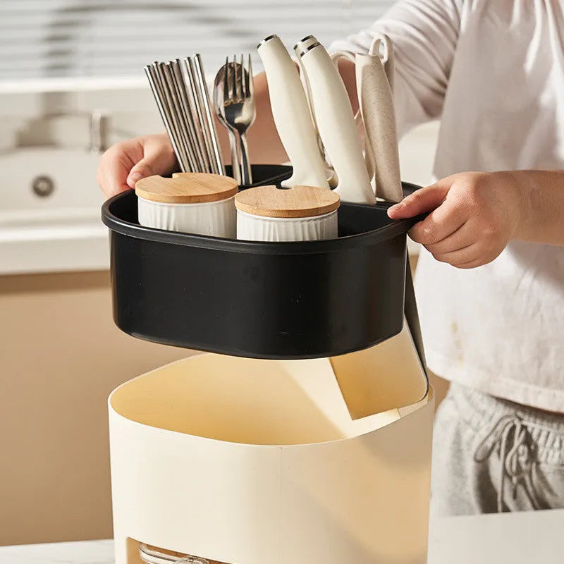 White rotating kitchen storage container with cutlery holder and four-section spice box organiser.