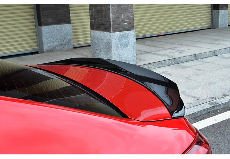 Bright black tail trim spoiler for Mazda 3 Axela Exela 2014-2021 models on rear of car