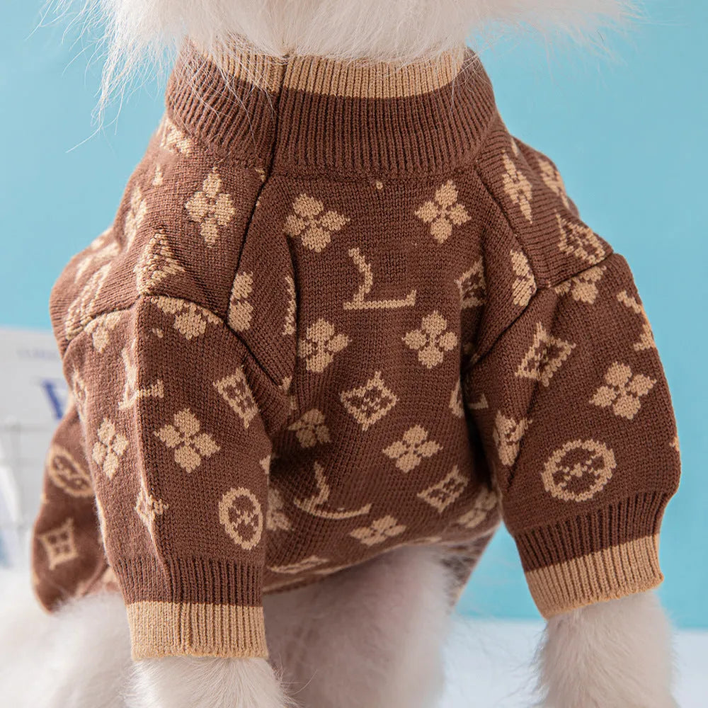 A dog wearing a thick, knitted wool sweater in a choice of monochrome or two-tone colours.