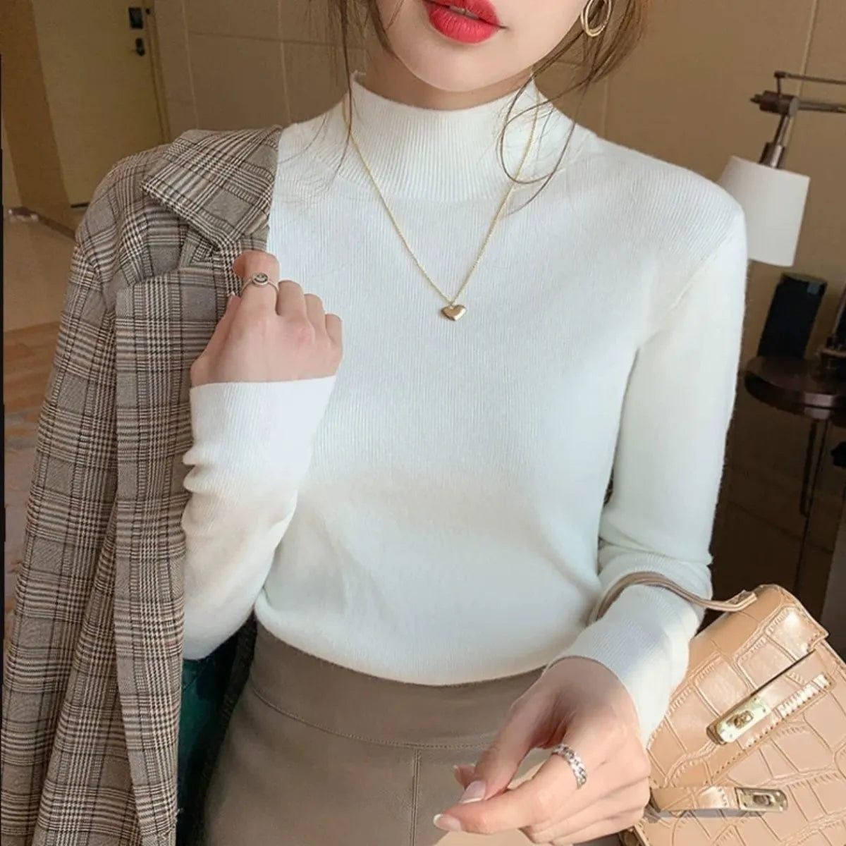 Slim fit viscose long sleeve top in apricot colour showing inner knitted bottoming detail.