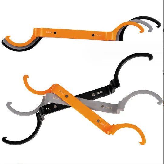 Crescent magnetic suction and catheter locking wrench three-piece set in orange, grey, and black.
