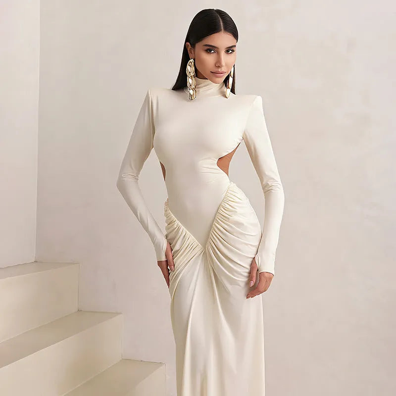 Long sleeve high collar slim fit dress with pleated backless detail in light apricot colour.