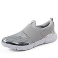 Blue, black, and grey women's low-top sneakers with mesh interior and casual design.