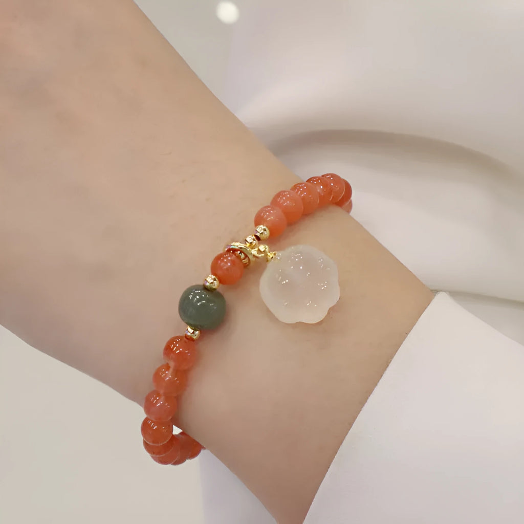 Natural red agate bracelet with cat paw design in gem inlay, 6mm width
