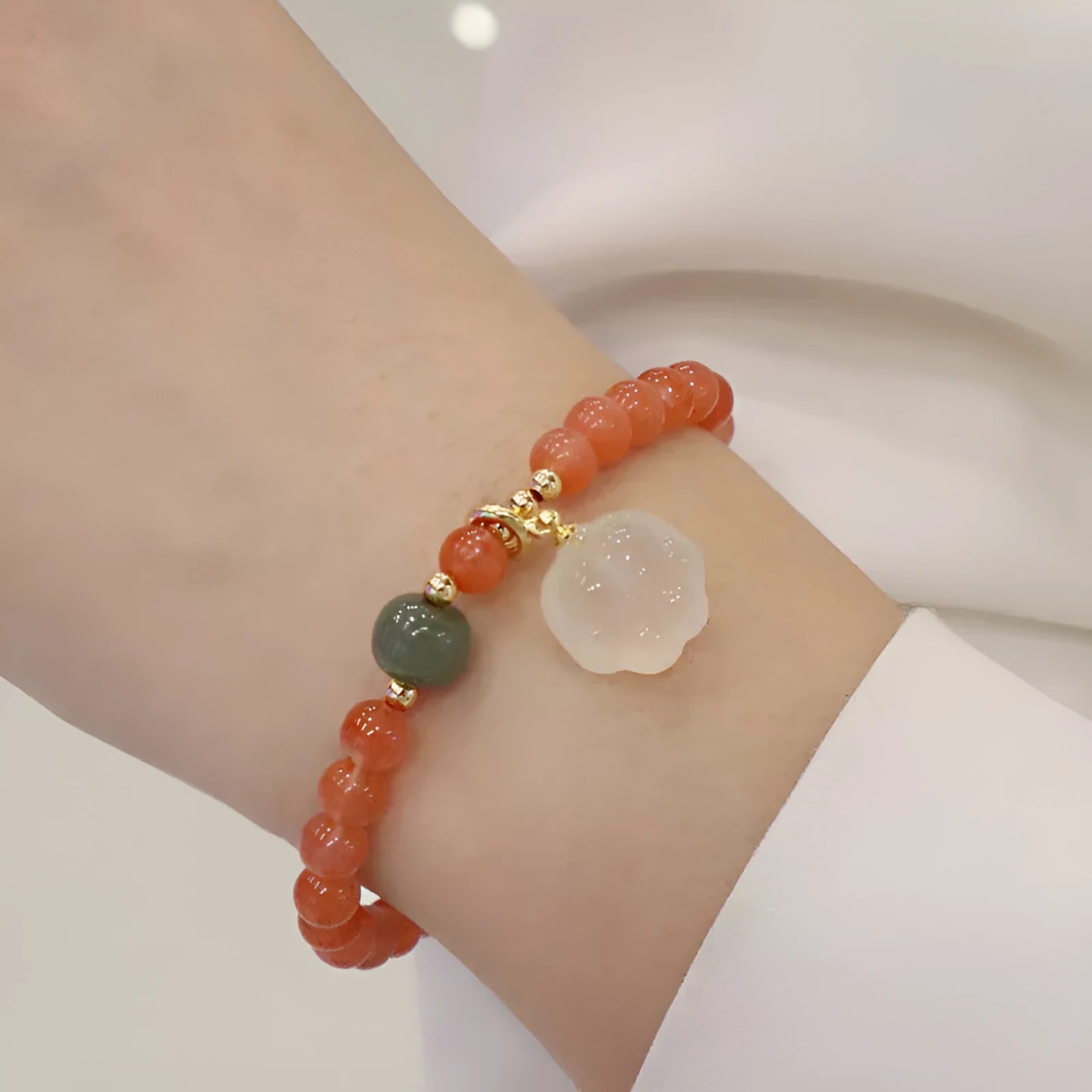 Natural red agate bracelet with cat paw design in gem inlay, 6mm width