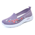 Women's wine red embroidered floral sports pumps with a flat heel and anti-slip sole on a white background.