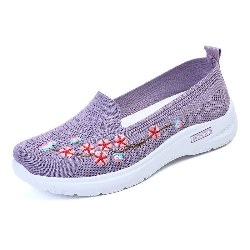 Women's wine red embroidered floral sports pumps with a flat heel and anti-slip sole on a white background.