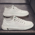 Men's white casual flat shoes with round toe and PU upper on a plain background