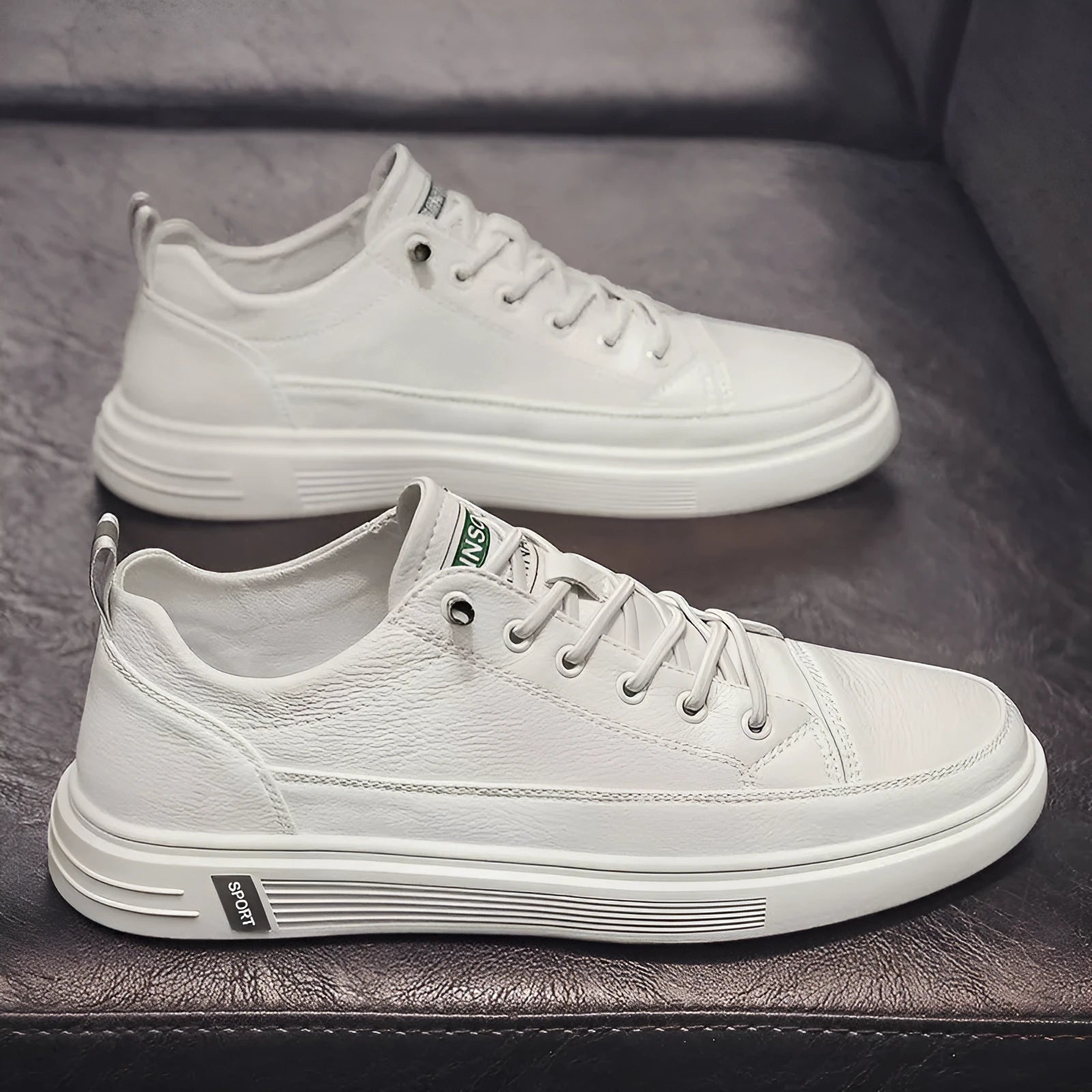 Men's white casual flat shoes with round toe and PU upper on a plain background