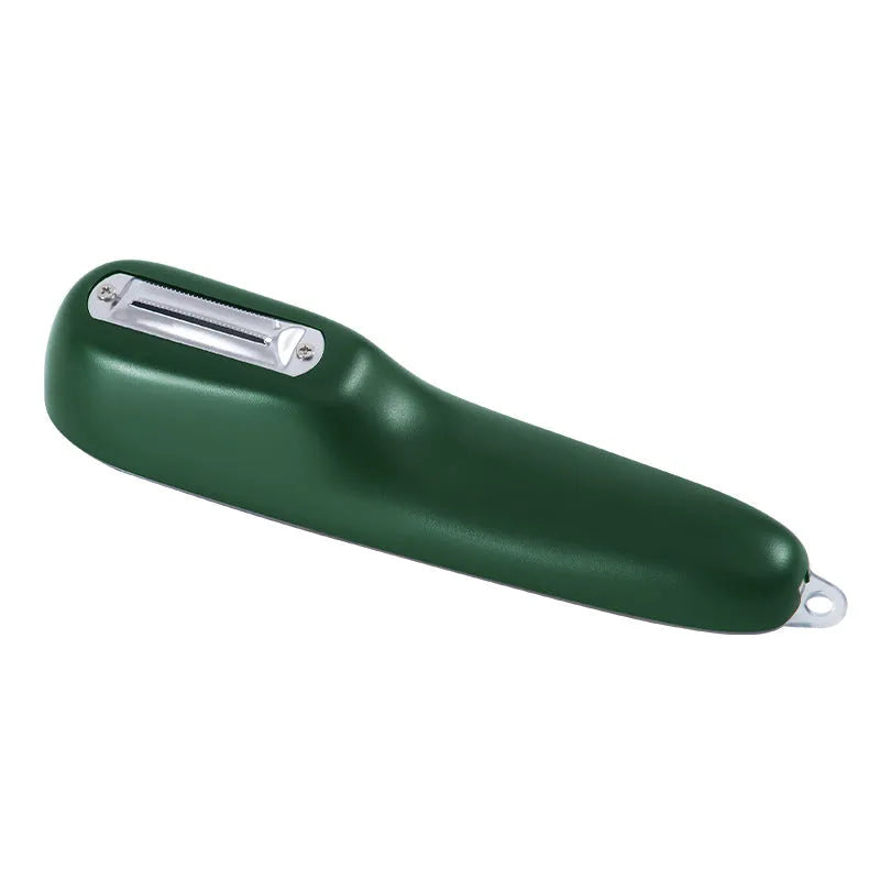 Dark green kitchen peeler with a storage tube, stainless steel blade, and non-slip plastic handle on a worktop.