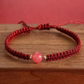 Woven red rope bracelet with natural strawberry quartz beads and alloy metal components