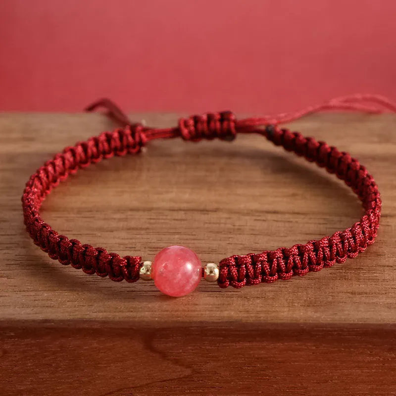 Woven red rope bracelet with natural strawberry quartz beads and alloy metal components