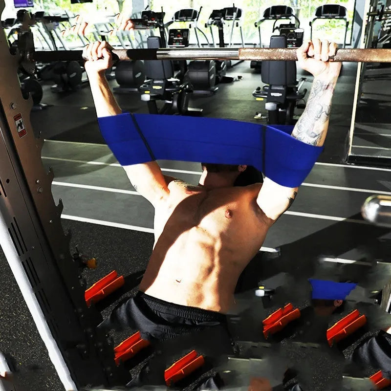 Elastic elbow support bandage for boxing and fitness, shown in black, wrapped around an elbow joint.