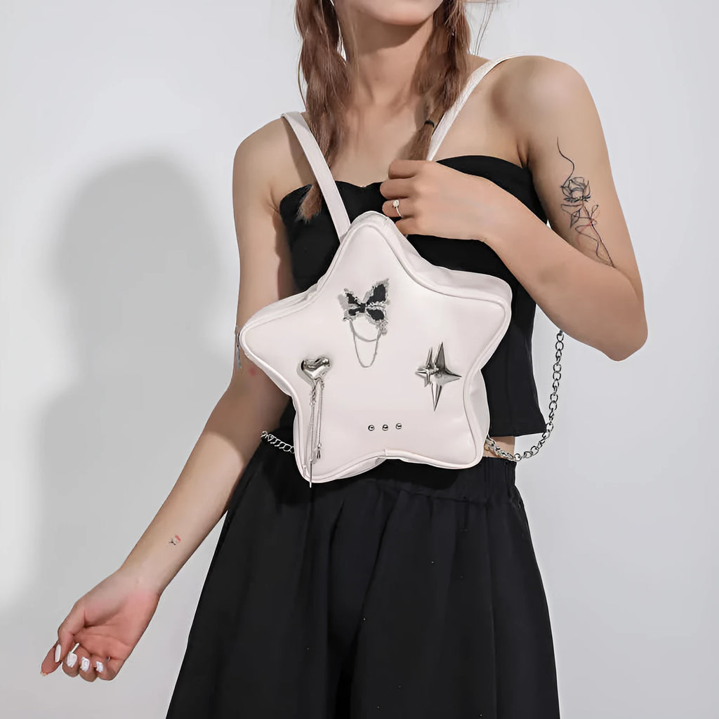 Soft black PU women's mini backpack worn across the body as a messenger bag.