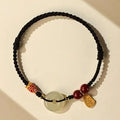 Hetian jade peace buckle bracelet showing 10mm geometric stones on braided rope with adjustable design