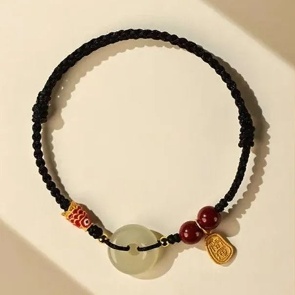 Hetian jade peace buckle bracelet showing 10mm geometric stones on braided rope with adjustable design