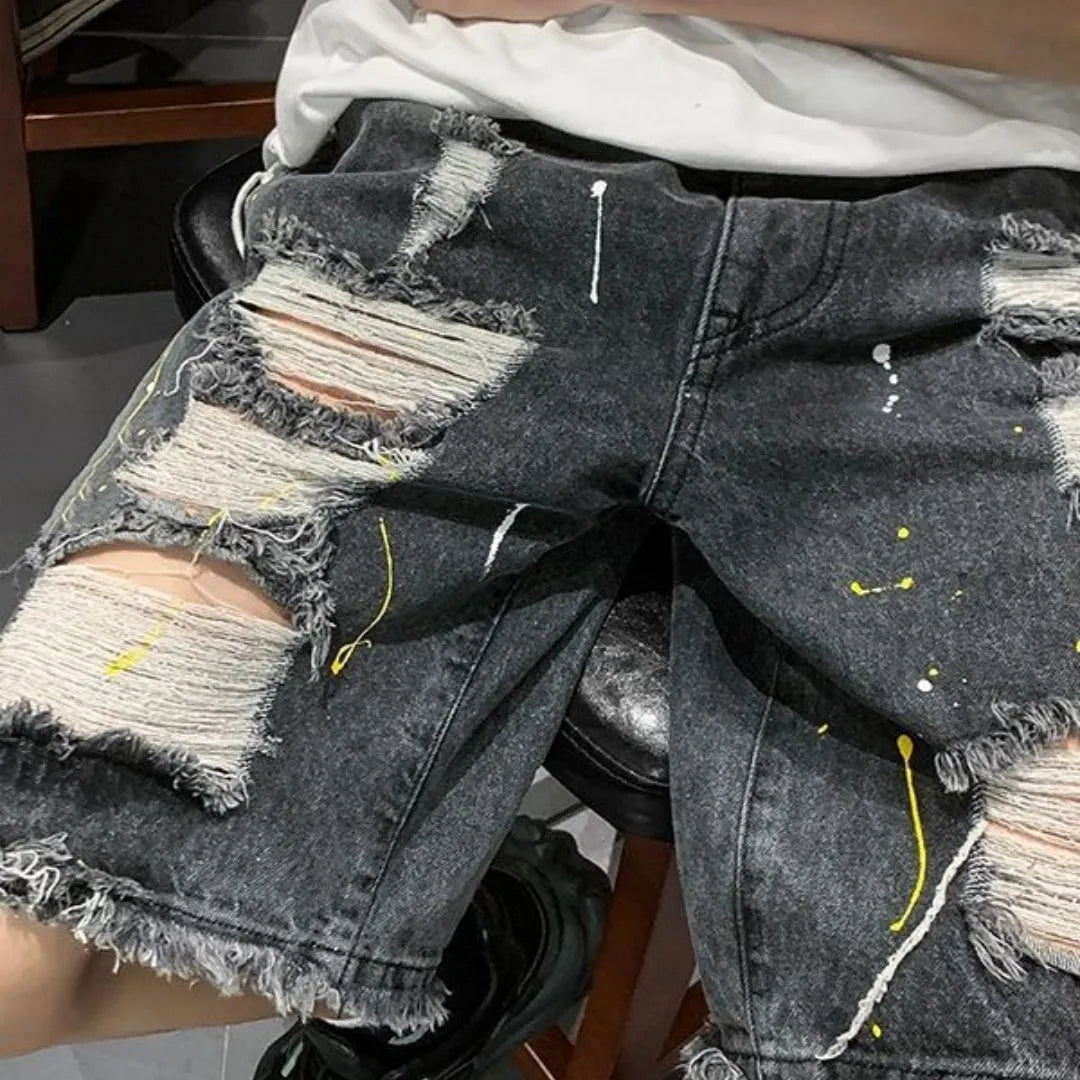 Men's loose fit denim shorts with water-washed finish and hole design in black colour