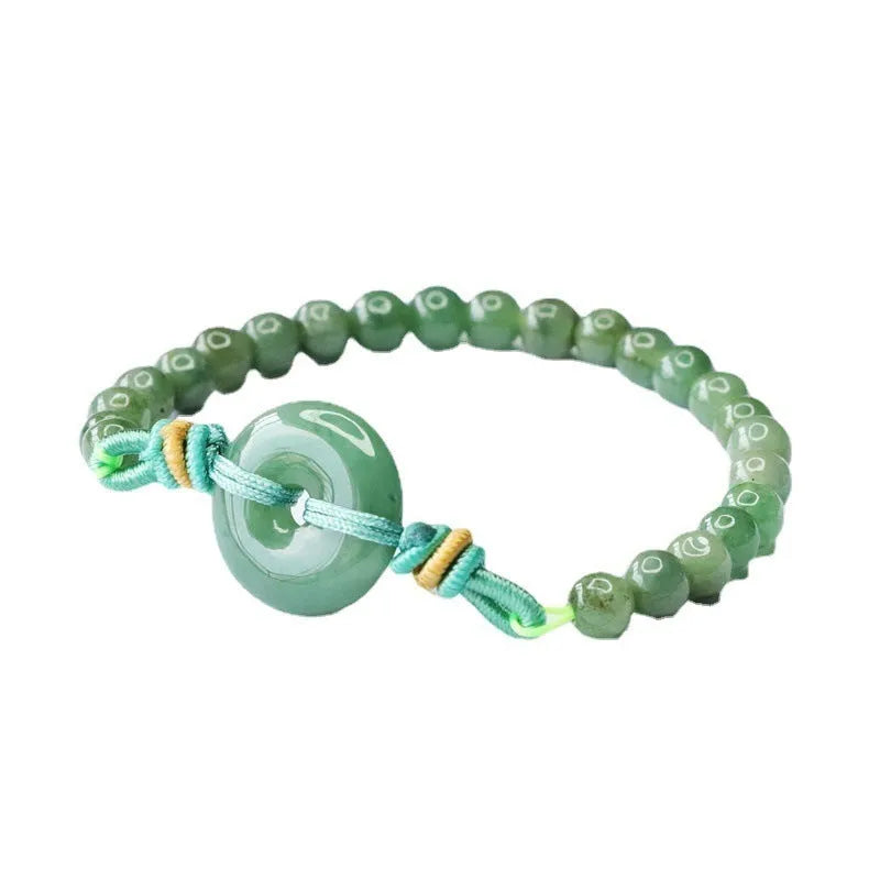 Emerald green jade bracelet with peace buckle clasp and star design elements