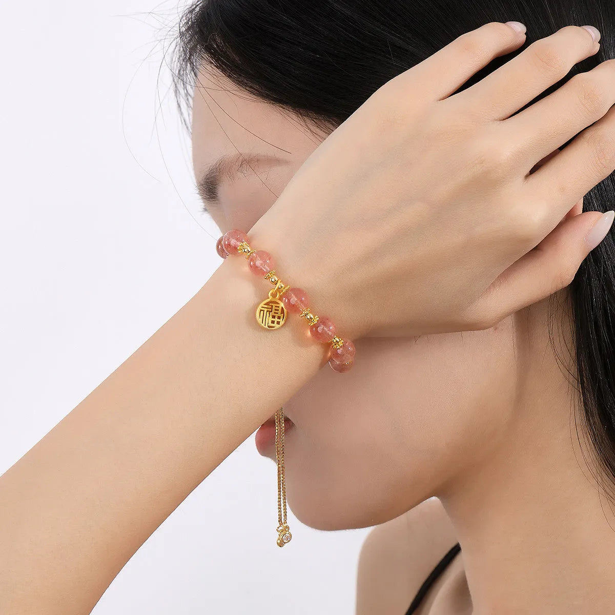 Strawberry quartz crystal bracelet with geometric shapes and fu character symbols