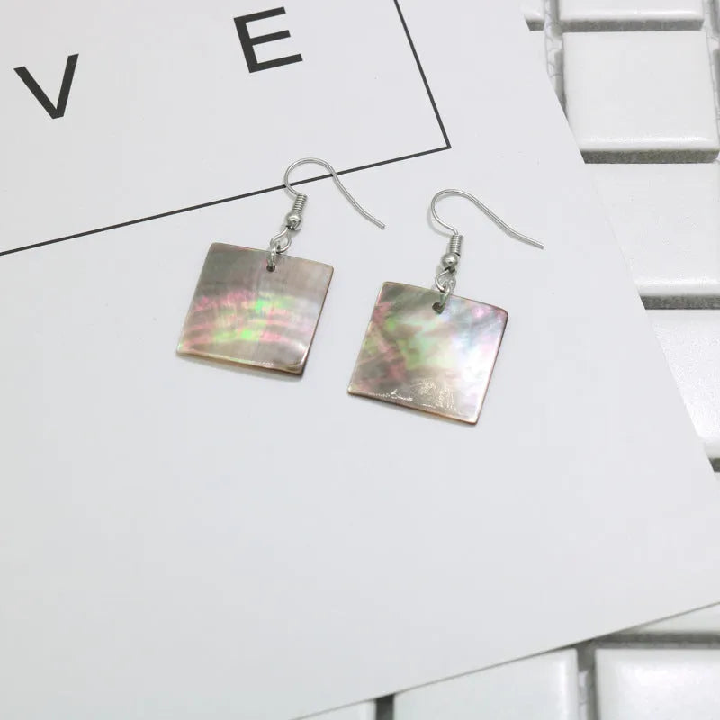 Women's shell geometric earrings with rectangular and square panther designs in natural shell material