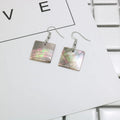 Women's shell geometric earrings with rectangular and square panther designs in natural shell material