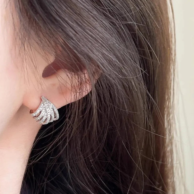 A pair of women's geometric line design earrings in platinum-finished zircon.