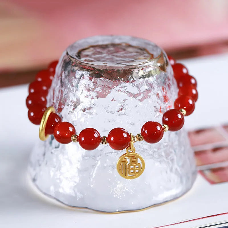 Natural red agate bracelet with hand-woven cord in national style, shown with blessing card.