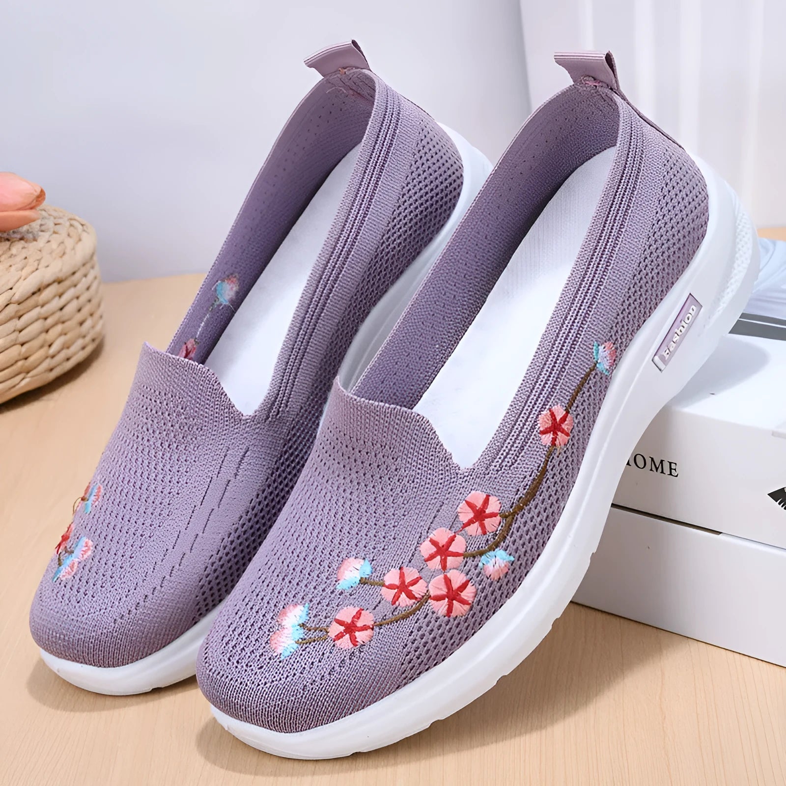 Women's wine red embroidered floral sports pumps with a flat heel and anti-slip sole on a white background.