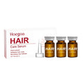 Three small 5ml bottles of nourishing hair root liquid with ginger and rosemary extracts