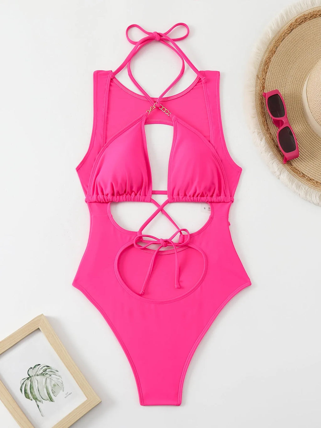 Bright pink nylon one-piece swimsuit with sexy cutout strap design for adult women