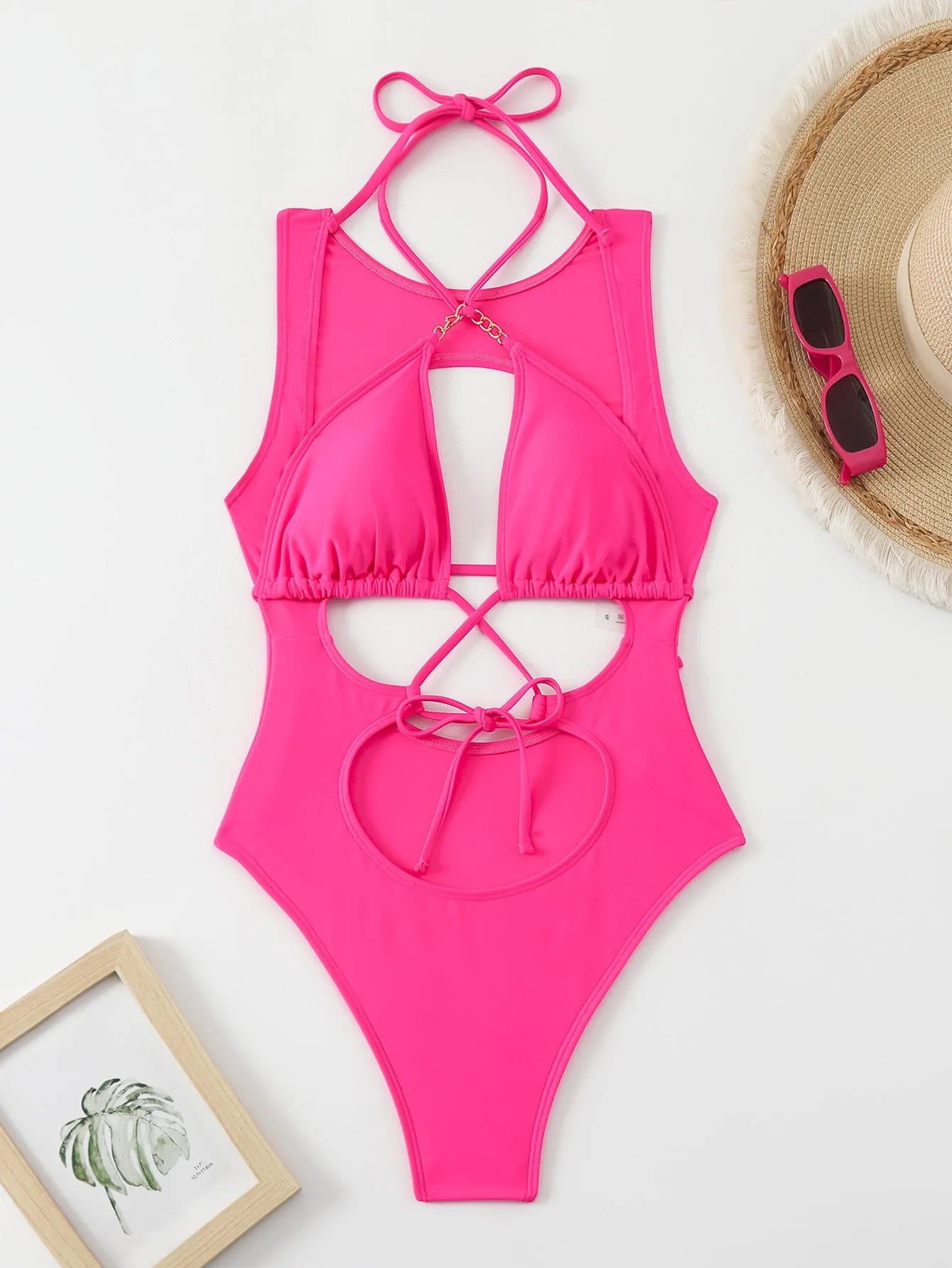 Bright pink nylon one-piece swimsuit with sexy cutout strap design for adult women